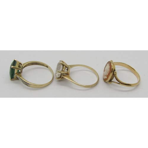 311 - Three 9ct dress rings to include a green paste and diamond example, size P/Q and a cameo example, 8.... 