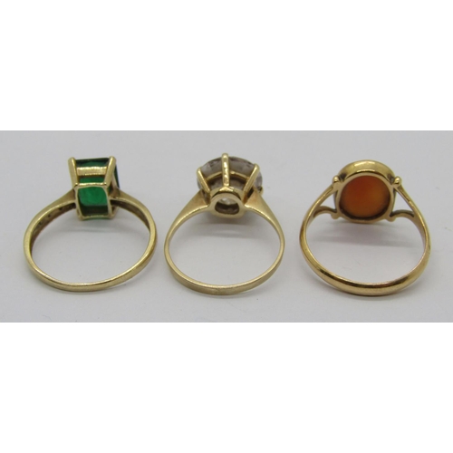 311 - Three 9ct dress rings to include a green paste and diamond example, size P/Q and a cameo example, 8.... 