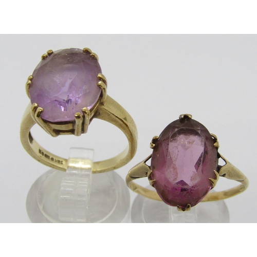 312 - 9ct claw set oval pale amethyst dress ring, together with a further 9ct example set with amethyst co... 