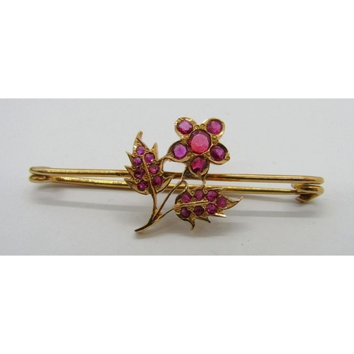 314 - Yellow metal bar brooch set with a floral cluster of rubies, 4.2cm W approx, 3.1g, contained in a po... 