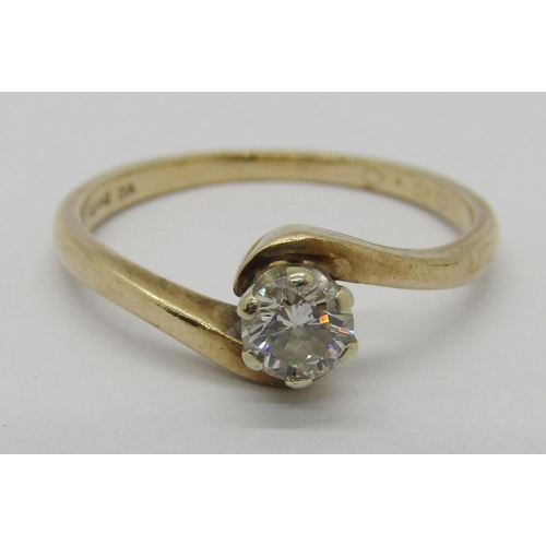 320 - 9ct diamond solitaire crossover ring, 0.20ct approx, 2g