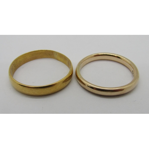 322 - Two gold wedding rings; a 9ct example, 3g and a high carat example (18ct or 22ct - marks worn), 3.4g