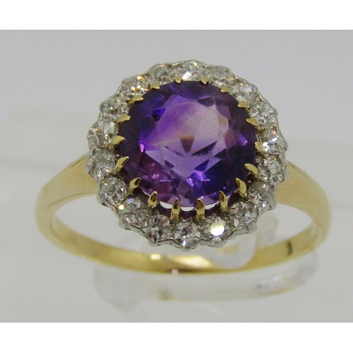 324 - Mid-20th century yellow metal amethyst and diamond halo cluster ring, ring head 1.3cm diameter appro... 