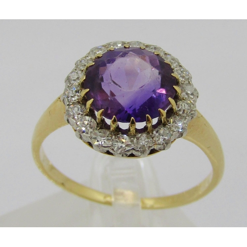 324 - Mid-20th century yellow metal amethyst and diamond halo cluster ring, ring head 1.3cm diameter appro... 