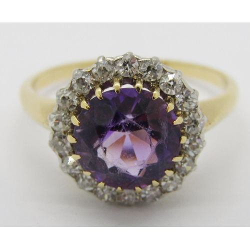 324 - Mid-20th century yellow metal amethyst and diamond halo cluster ring, ring head 1.3cm diameter appro... 