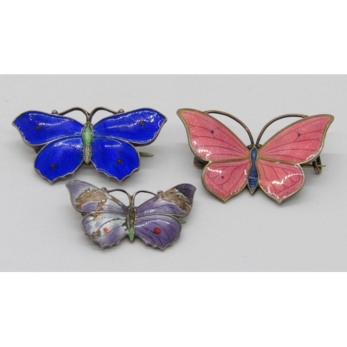 342 - Three enamelled silver butterfly brooches; a pink 830S example by Marius Hammer, a cobalt blue examp... 