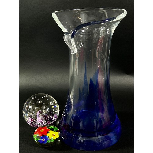 134 - A late 20th century continental glass vase with a folded torn rim, clear glass darkening to blue, 27... 