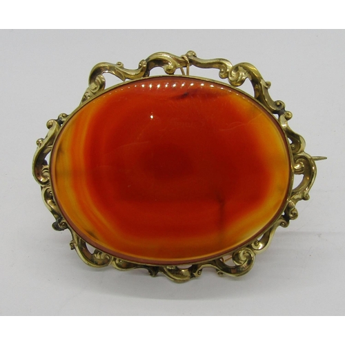 360 - Small group of jewellery including a large Victorian polished carnelian brooch with scrolled gilt me... 