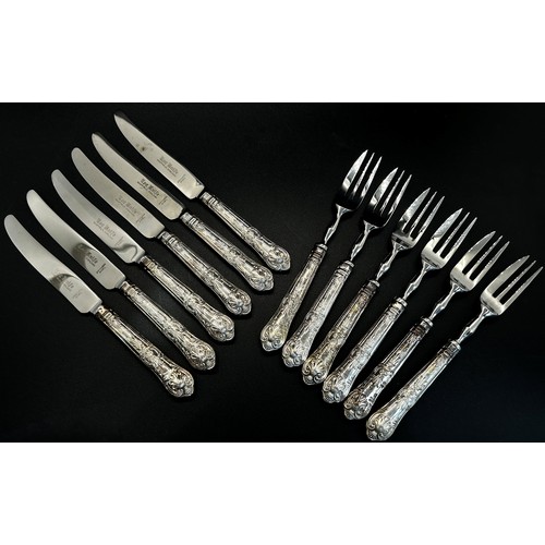 203A - A cased set of silver handled tea knives and a cased set of forks, and a tortoiseshell and silver dr... 