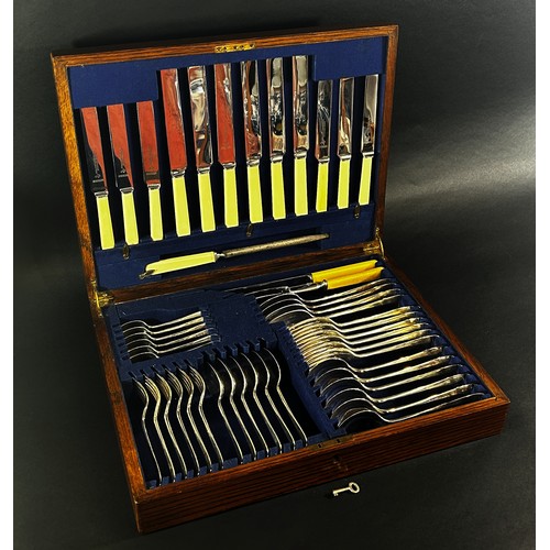 261 - An oak canteen of Atkins Brothers silver plated cutlery complete for six settings, including a soup ... 