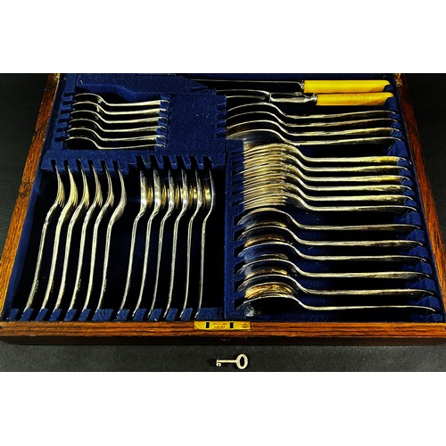 261 - An oak canteen of Atkins Brothers silver plated cutlery complete for six settings, including a soup ... 