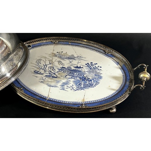 265 - A silver plated domed top meat server with a Willow Pattern plate, together a French silver beaker, ... 