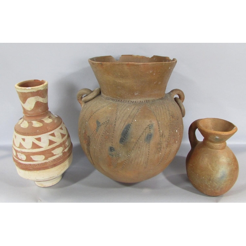 452 - Ethnic pottery of African/Indian/South American and other origin, together with a collection of foss... 