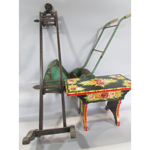 454 - A 19th century wooden wool winder, a brightly painted barge style flowery stool, and a child's lawn ... 