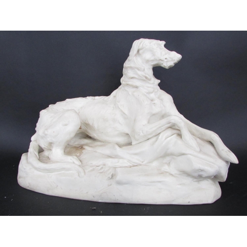 463 - A Parian study of a Deer Hound in an alert pose, 35cm x 25cm, and another smaller gnawing a bone, 19... 