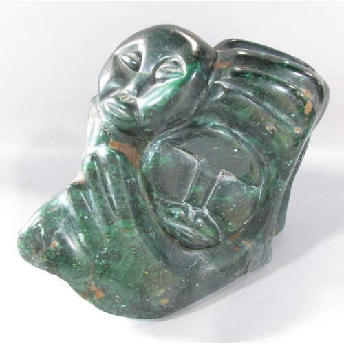 465 - A Zimbabwe Shona Stone Carving of two people embracing, 22cm x 24cm.