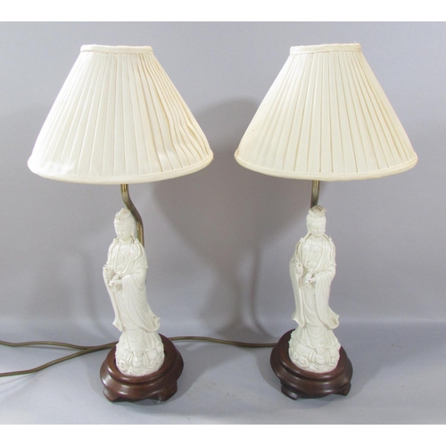 471 - A pair of figural table lamps, with Chinese Blanc de Chine figures of Guanyin, 40cm tall.