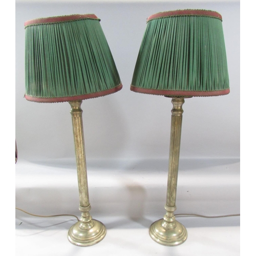 472 - A pair of brass column lamps both with shades, 60cm high approx.