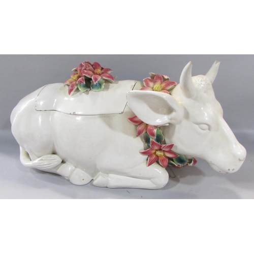 476 - A large novelty ceramic storage cow wearing a garland of flowers, together with a pair of classicall... 