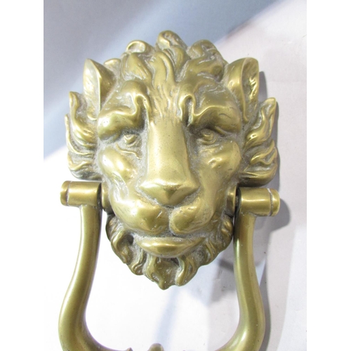 478 - A brass lion mask door knocker, with screw fastenings, 24cm.