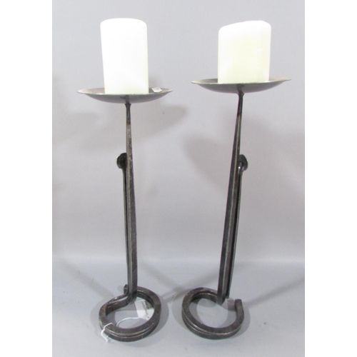 485 - A pair of hand forged iron candlesticks, 43cm high.