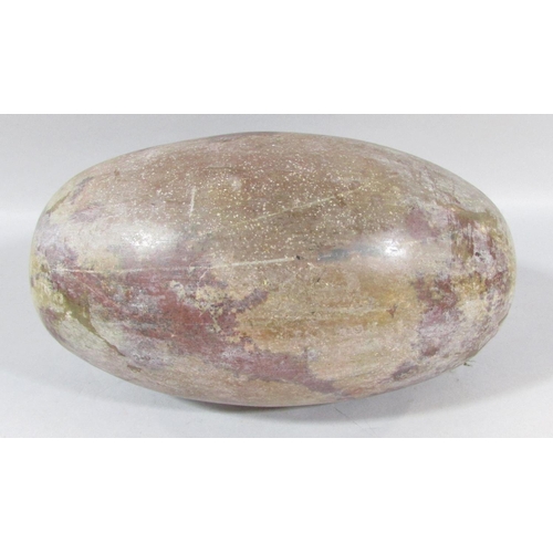 486 - An Indian natural stone Shiva Lingam 25cm wide.