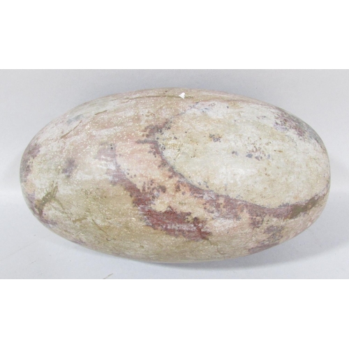 486 - An Indian natural stone Shiva Lingam 25cm wide.