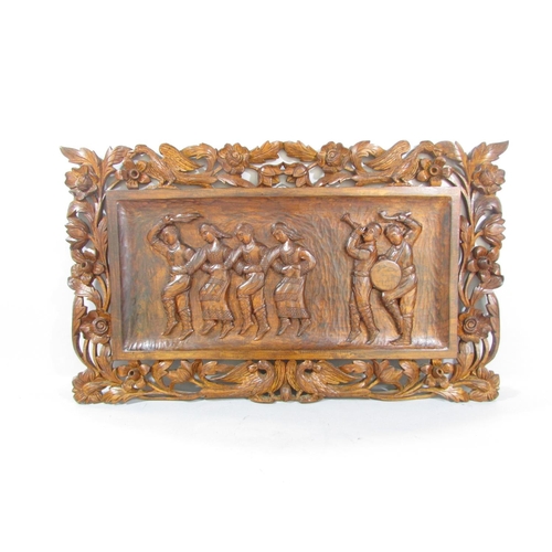 488 - A carved wooden panel with six folk dancers signed 'D. Jankov Ohrid', a small wooden longcase clock,... 