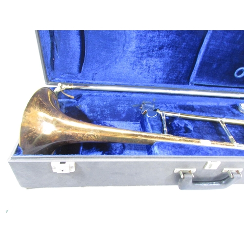 490 - A Vintage Boosey & Hawkes brass trombone, with two mouth pieces in it’s original case.