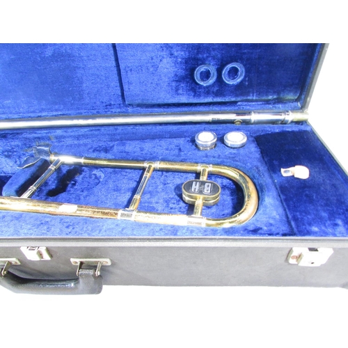 490 - A Vintage Boosey & Hawkes brass trombone, with two mouth pieces in it’s original case.