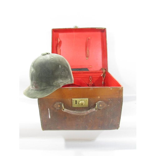 491 - A Vintage Leather hat box containing a vintage Patey horse riding helmet.