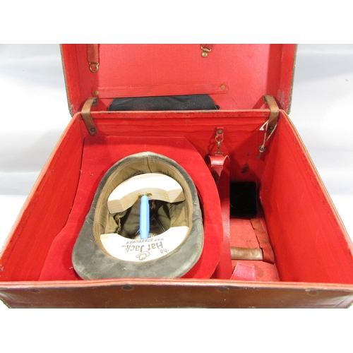 491 - A Vintage Leather hat box containing a vintage Patey horse riding helmet.