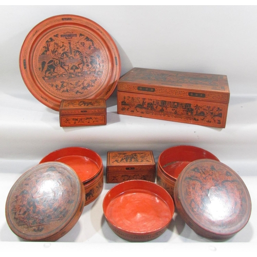 500 - A collection of five Burmese red lacquered ware, two circular boxes, a single rectangular box and tw... 