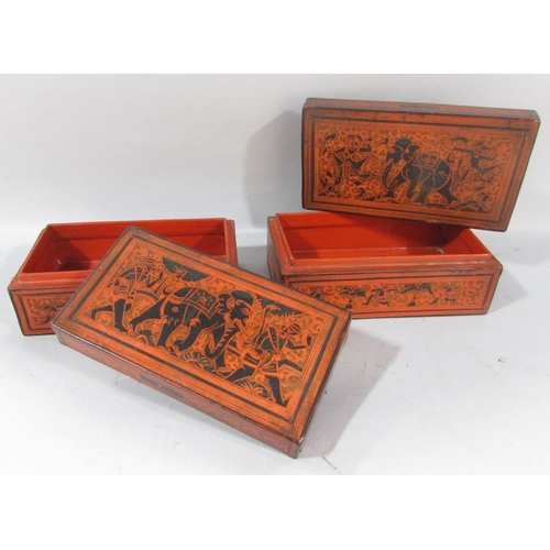 500 - A collection of five Burmese red lacquered ware, two circular boxes, a single rectangular box and tw... 