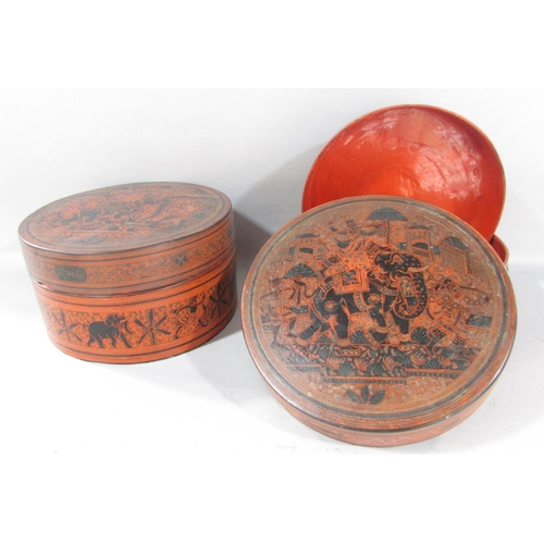 500 - A collection of five Burmese red lacquered ware, two circular boxes, a single rectangular box and tw... 