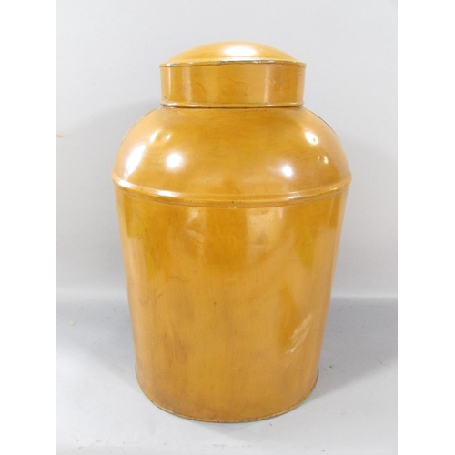 504 - A large mustard coloured tin tea canister / caddy 45cm high together with, a tin tortoise shell tea ... 