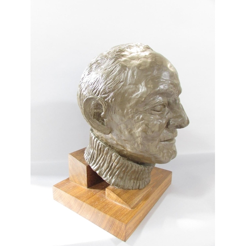 511 - A bronzed resin bust of Arthur Frith, wearing a crew neck jumper, set on a wooden plinth, 35cm high