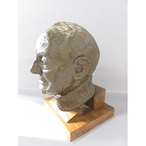 511 - A bronzed resin bust of Arthur Frith, wearing a crew neck jumper, set on a wooden plinth, 35cm high