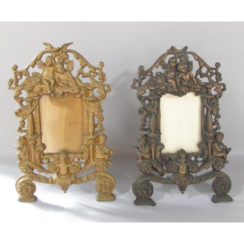 516 - A pair of Rococo frames with cherubs and scrolling to the  gold finished frames 36cm x 23cm together... 