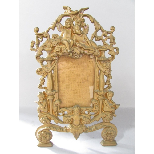 516 - A pair of Rococo frames with cherubs and scrolling to the  gold finished frames 36cm x 23cm together... 