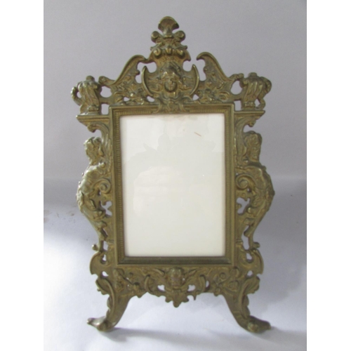 516 - A pair of Rococo frames with cherubs and scrolling to the  gold finished frames 36cm x 23cm together... 