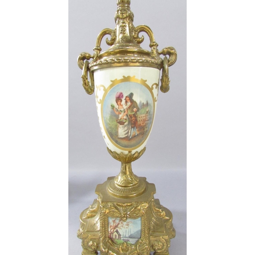 519 - A pair of brass urn shaped clock garnitures with a romantic pastoral scene, a circular tavern scene ... 