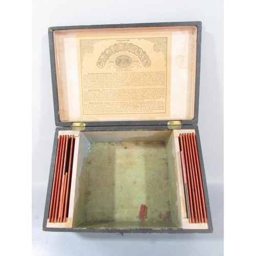 523 - A 19th century German 'Laterna Magica', candle lit slide projector with it’s original box and a sele... 