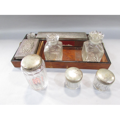 525 - A 19th century rosewood travelling stationery/ vanity box, with some original glass and silver plate... 