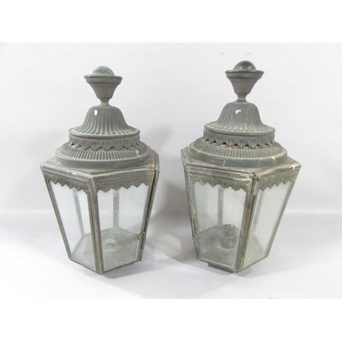 532 - A pair of Victorian hexagonal carriage lamps, in a weathered finish, 33cm high. (One glass panel cra... 