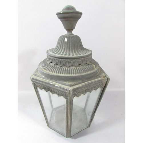 532 - A pair of Victorian hexagonal carriage lamps, in a weathered finish, 33cm high. (One glass panel cra... 