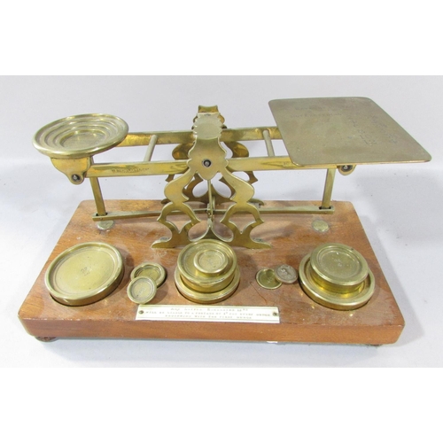 534 - Two pairs of Georgian steel sugar nips, a pair of Victorian postal scales with a selection of weight... 