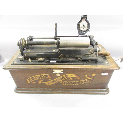 535 - An Edison Home Phonograph (A/F) with a selection of sixteen wax cylinder recordings.