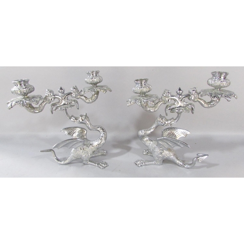 543 - A pair of chromium plated dragon candlesticks 22cm x 22cm, a chromium plated miniature statue of Her... 