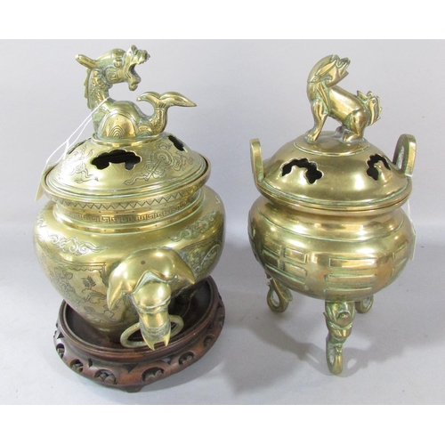 545 - A Chinese bronze censer, with elephant head handles and dragon mounted cover and engraved birds and ... 